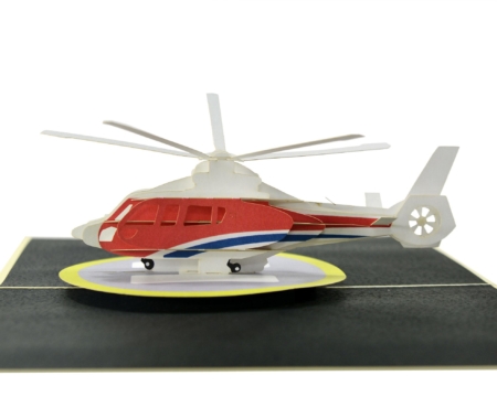 3D red, white and blue helicopter on landing pad open flat