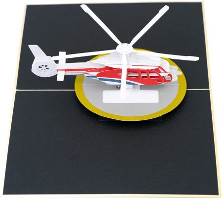 3D red, white and blue helicopter on landing pad.